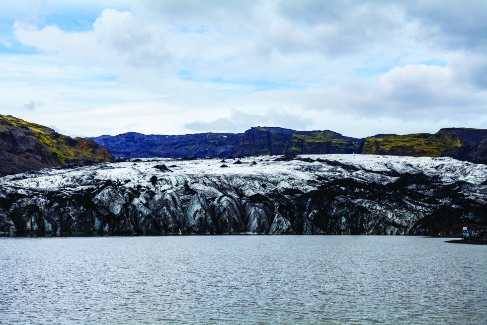 A glacier melting into a lake.