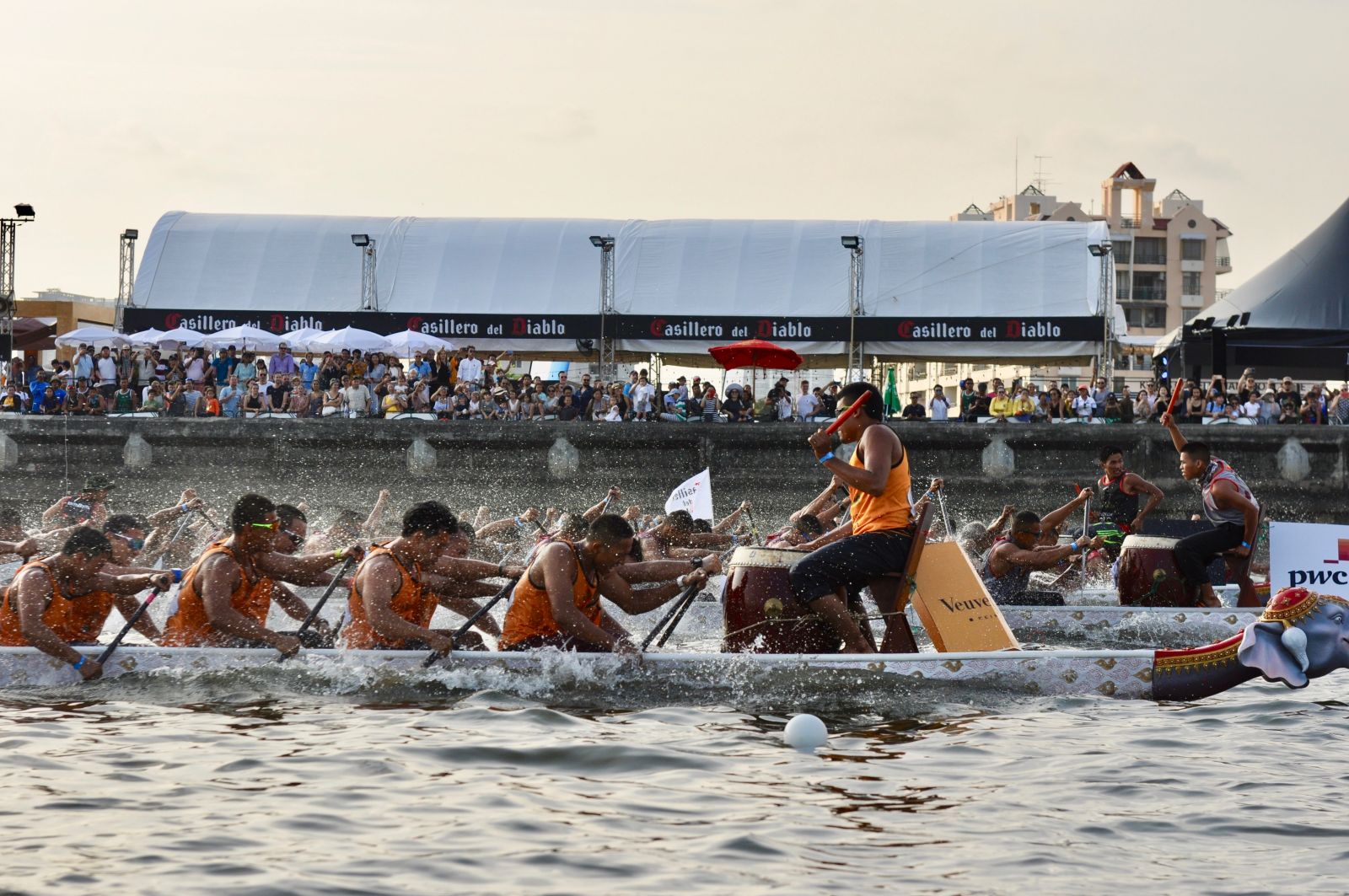 Drummers beat a rhythm to keep the paddlers moving